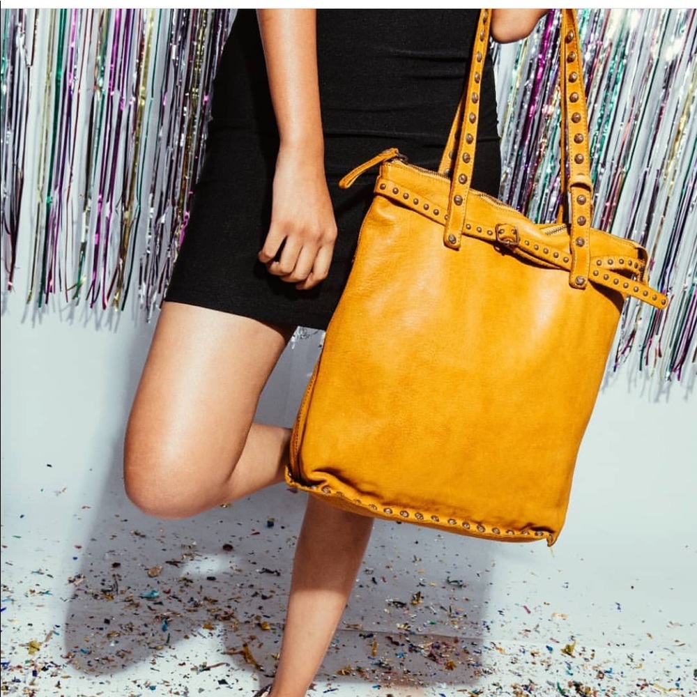 Genuine leather handbag with metal studs